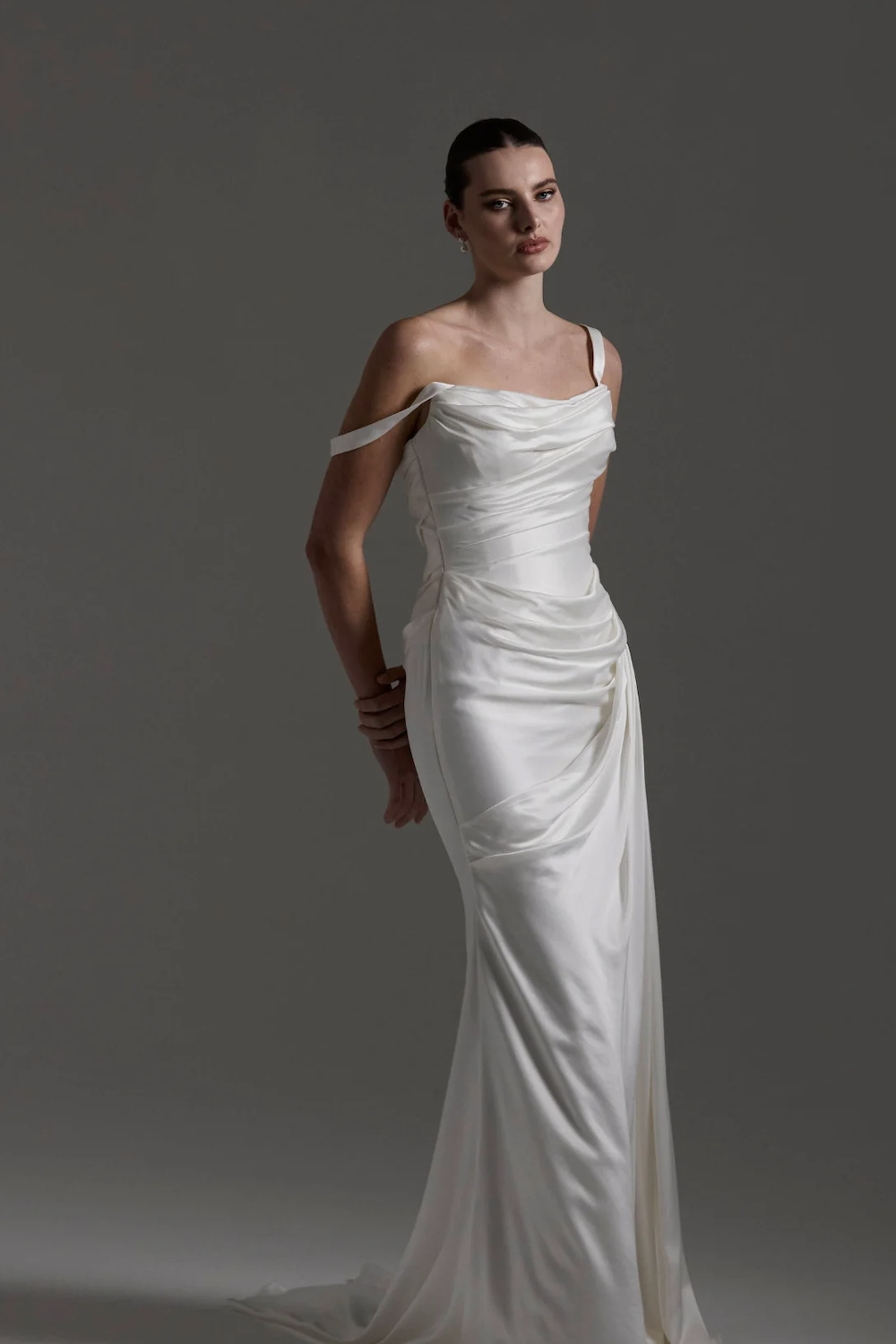A bride in a fitted strapless satin gown